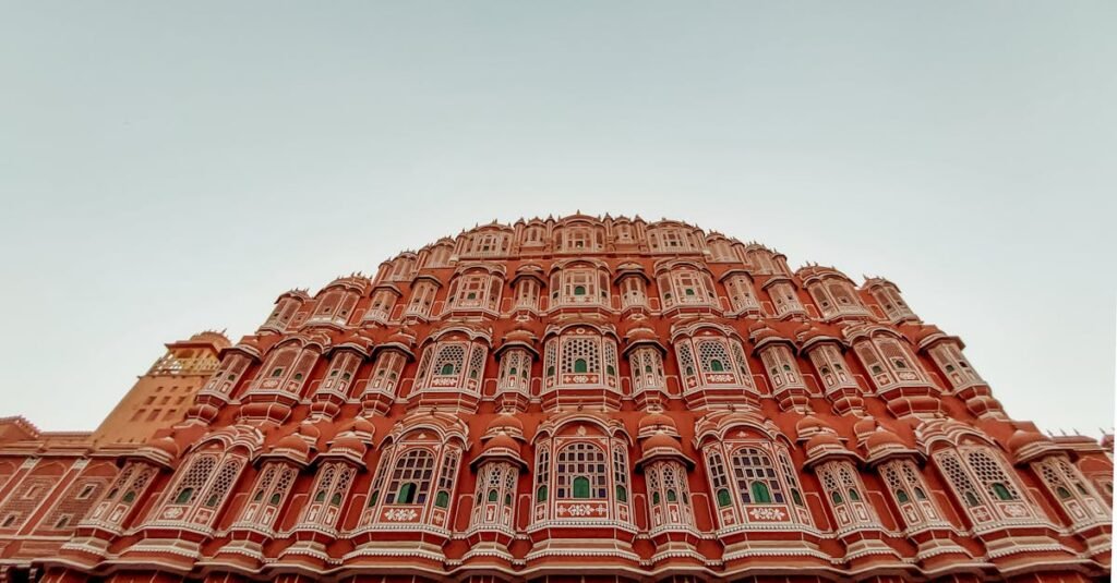 Low angle view of iconic Hawa Mahal facade in Jaipur, India. Captivating architectural marvel.