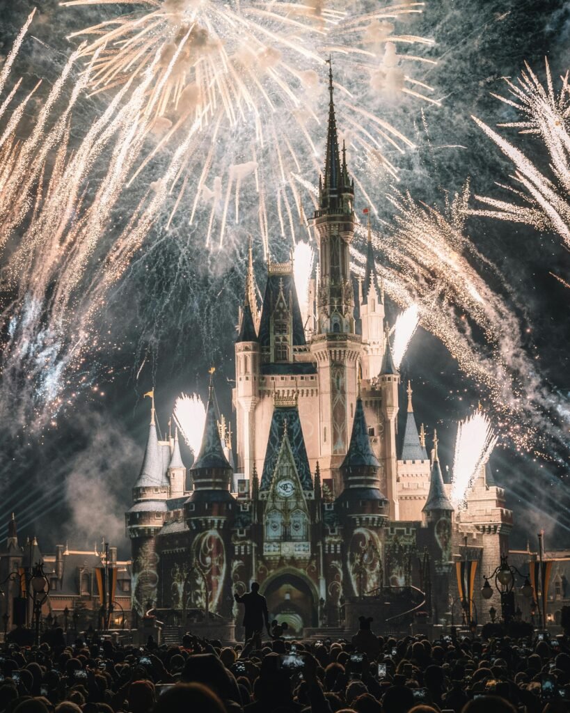 Enchanting night view of a famous castle illuminated by spectacular fireworks, capturing a magical ambiance.