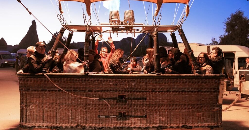 Group of people preparing for a sunrise hot air balloon flight in Cappadocia, Turkey.